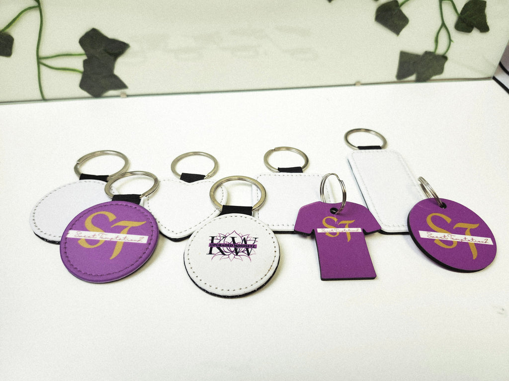 White MDF Keychain that can be customized with sublimation by Jennnayyy's.  The shapes are circle, heart, rectangle, tshirt, and square, bone and home.  Included are some examples of what they look like after.